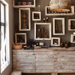 Namibian statuettes and pottery on framed shelves