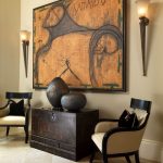 Warm colour palette and dark espresso furnishings and decor with 2 torch  wall sconces flanking a