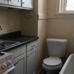 Apartment features all-in-one bathroom and kitchen