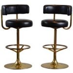 Pair of vintage swivel brass bar stools