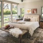 Antique Rug Master Bedroom with Fluffy Pillows and Throw with Artwork