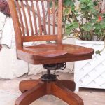 Antique Bankers Oak rolling Desk CHAIR 1920s wood casters library industrial