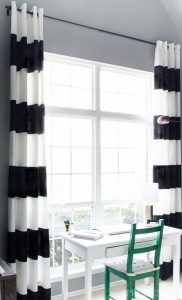 Black and white striped curtains add chic style to any room. Check out  these tips