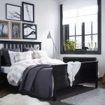 A bedroom featuring HEMNES solid wood bed, nightstand and wardrobe in black -brown