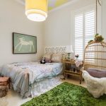 Playful Kids Bedroom With Chevron Ceiling and Birdcage Chair