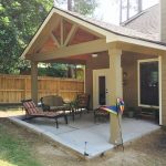 Gable roof patio cover with wood stained ceiling