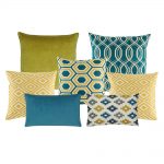 A set of 6 square and rectangular cushion covers in blue and gold colours  and with