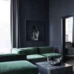 Luxurious Living Room With Dark Walls and A Deep Green Velvet Sofa