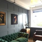 Dark Green Velvet Sofa with Blue walls
