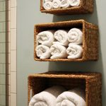 Bathroom Towel Storage Ideas: Another way to take advantage of vertical  space is by hanging baskets on the wall above the toilet or tub and using  them to