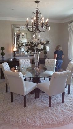 Remove the chandelier and center piece and this is perfect Glass Round Dining  Table, Dinning