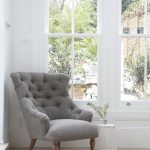 Gray chambray on tufted chair in kitchen designed by @jamieblake