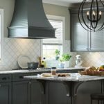 Kitchen with backsplash featuring tile shapes influenced by global trends.