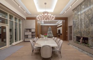 Large 10-person dining room table in large formal dining room in luxury  home.