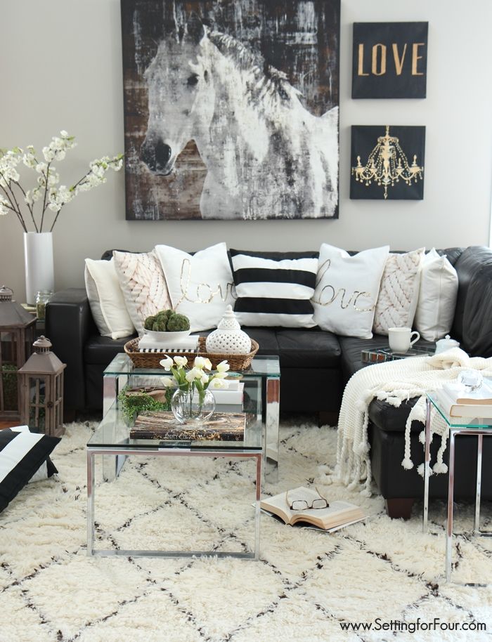 Living room decor ideas. Black, white and creamy neutrals with a pop of  green!