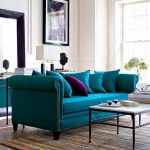 Love the turquoise sofa!