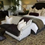 Like the above bedroom, this one places the loveseat at the foot of the bed