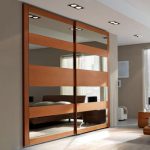 Mirrored sliding doors, contemporary closet designs perfect for small spaces