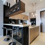 Modern kitchen design with integrated bar counter for a small condo home