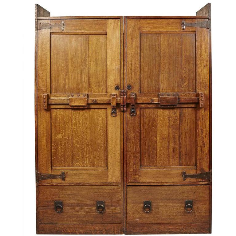 A Large Arts and Crafts Oak Wardrobe With Stylised Iron Hinges For Sale at  1stdibs