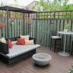 View in gallery Small outdoor bed with canopy for the compact modern deck