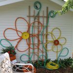 Make flowers from hoses for outdoor house decor