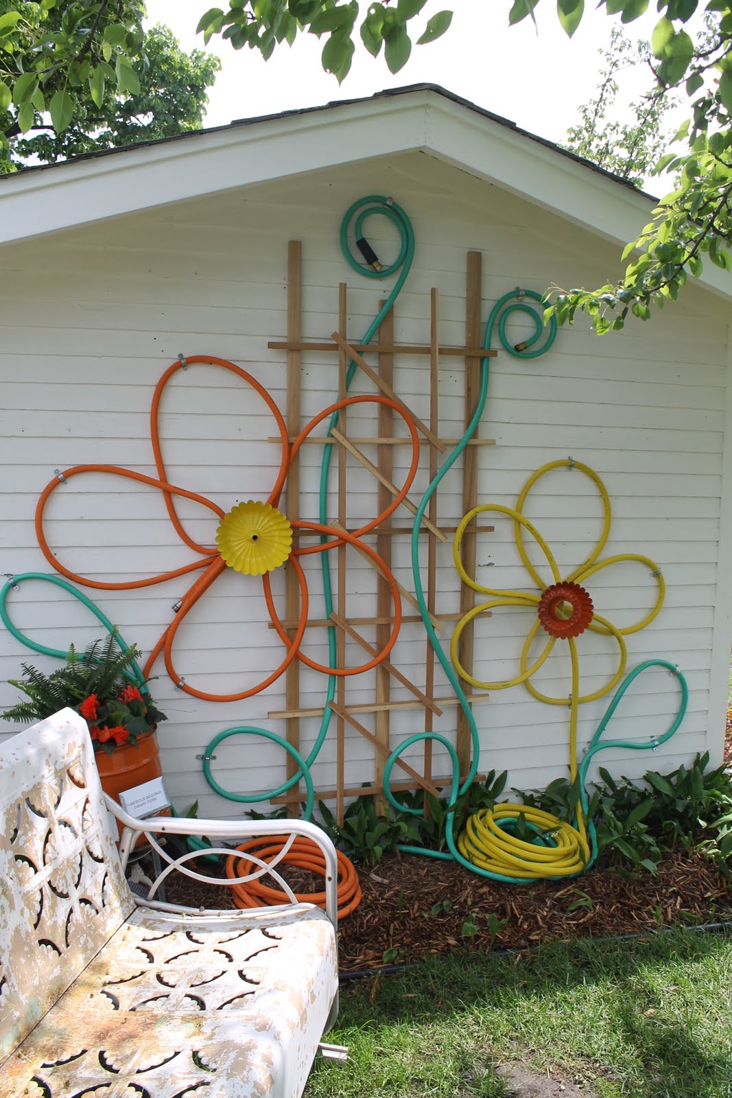 Make flowers from hoses for outdoor house decor