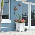 DIY tutorial to hang outdoor wall art without nails or tools on stucco,  siding or