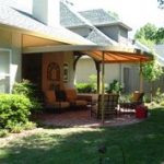 This custom patio awning creates an outdoor living room. #AwningsOfTulsa  Outdoor Living Rooms,