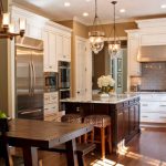 View in gallery Beautifully illuminated kitchen sports a couple of cool pendant  lights