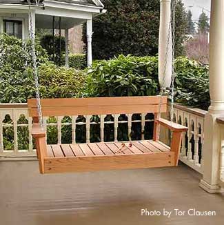 Wooden porch swing on beautiful porch