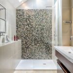Inspiration for a contemporary multicolored tile alcove shower remodel in  London with an integrated sink,