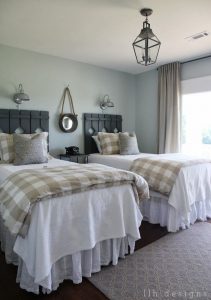 View in gallery Country guest room with rustic wood head boards on twin beds