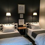 Small guest room with two twin beds. More