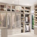 Light walk-in closet with pull-out rack closet accessories by California  Closets