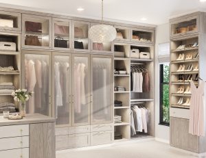 Light walk-in closet with pull-out rack closet accessories by California  Closets