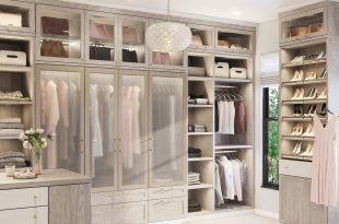Light walk-in closet with pull-out rack closet accessories by California  Closets