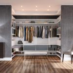 White Backed Walk in Closet with White Stand Alone Bench Closet Rods  Shelving and Grey Cabinets