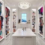 Walk-in closet - traditional gray floor walk-in closet idea in Houston with