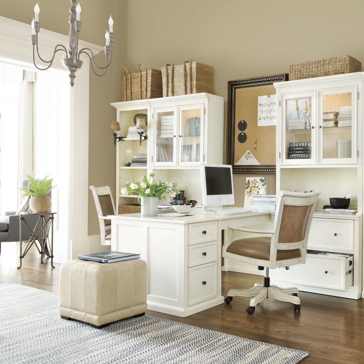 White and airy home office. Like the way the desks bump out so 2 people can  work in a small space.