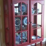 Repurposed top of hutch into Red distressed cabinet. Added legs and new  pulls. See more at Traveller Location in GA
