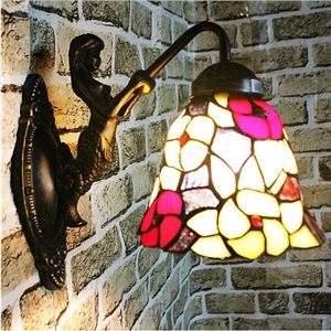Tiffany wall lights – visible glass works
  of art with cozy light