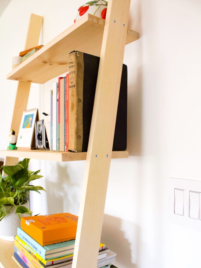 1698511395_Leaning-Bookshelf.jpg